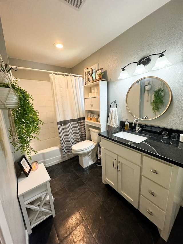 full bathroom featuring shower / bath combo, vanity, and toilet