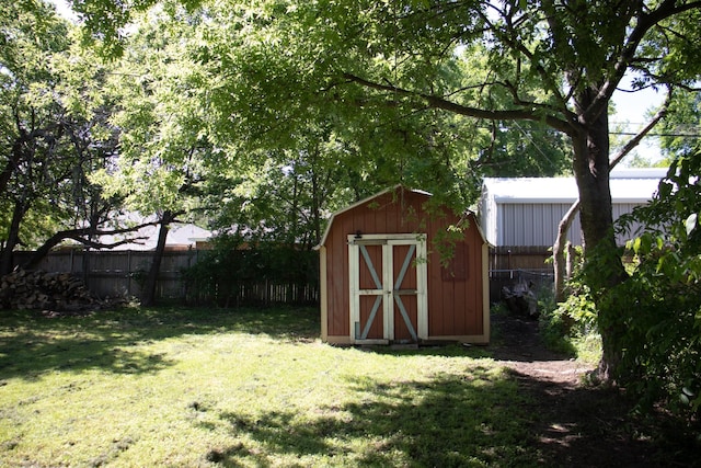 view of outbuilding with a lawn