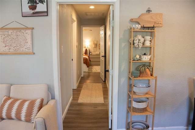 hallway with dark hardwood / wood-style floors