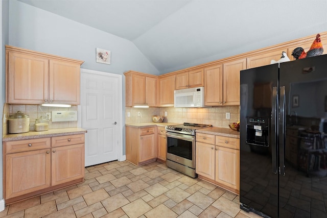 kitchen with lofted ceiling, black fridge, tasteful backsplash, light brown cabinets, and electric range