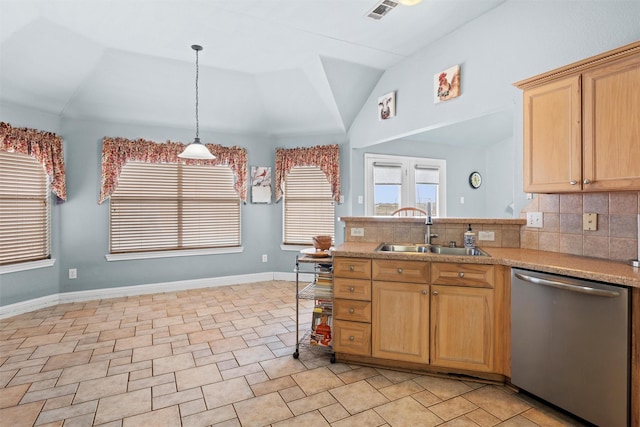 kitchen with sink, vaulted ceiling, stainless steel dishwasher, pendant lighting, and backsplash