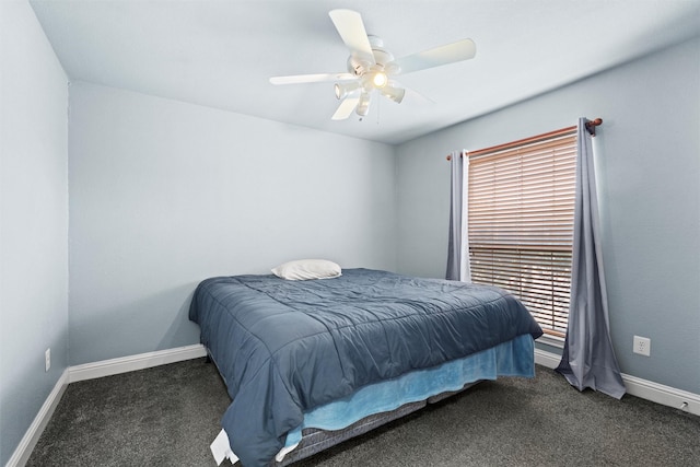 bedroom featuring dark colored carpet and ceiling fan