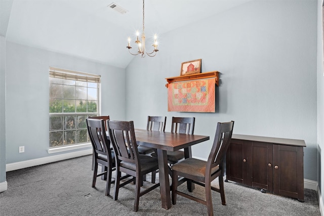 dining area with a notable chandelier, vaulted ceiling, and light colored carpet