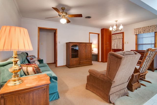 living room with crown molding, ceiling fan with notable chandelier, and light colored carpet