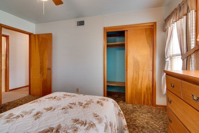 carpeted bedroom with ceiling fan and a closet