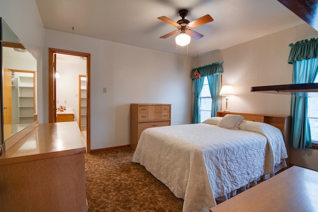 bedroom with ceiling fan and dark colored carpet