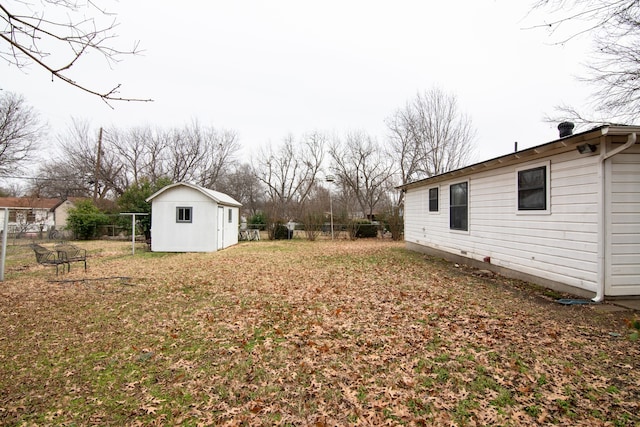 view of yard featuring a storage unit