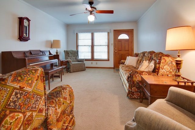 carpeted living room with crown molding and ceiling fan