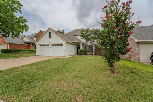 view of front of home with a garage and a front yard