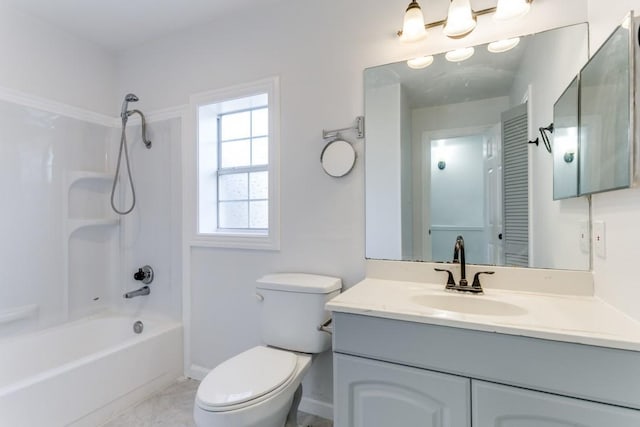 bathroom featuring baseboards, bathing tub / shower combination, toilet, and vanity