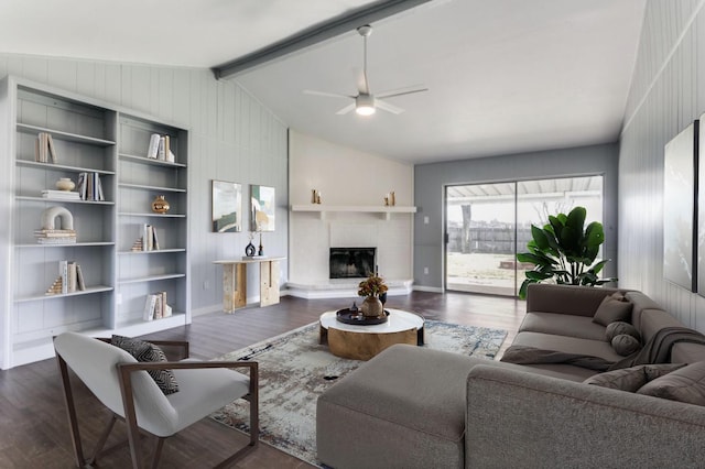 living room with lofted ceiling with beams, dark hardwood / wood-style floors, and ceiling fan