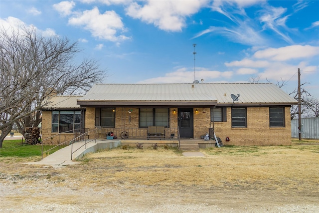 ranch-style house featuring covered porch