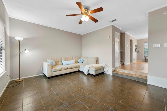 unfurnished living room with crown molding, ceiling fan, and dark tile patterned flooring