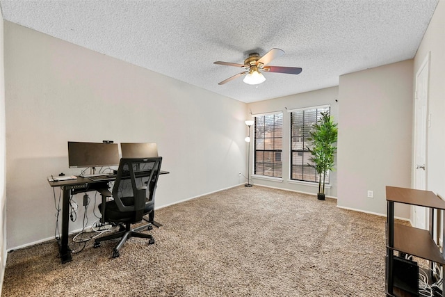 office space with a textured ceiling, carpet floors, and ceiling fan