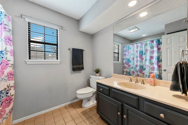 bathroom featuring vanity, tile patterned floors, a textured ceiling, and toilet