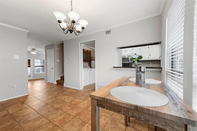 dining room with crown molding, washer and clothes dryer, ceiling fan with notable chandelier, and light tile patterned floors