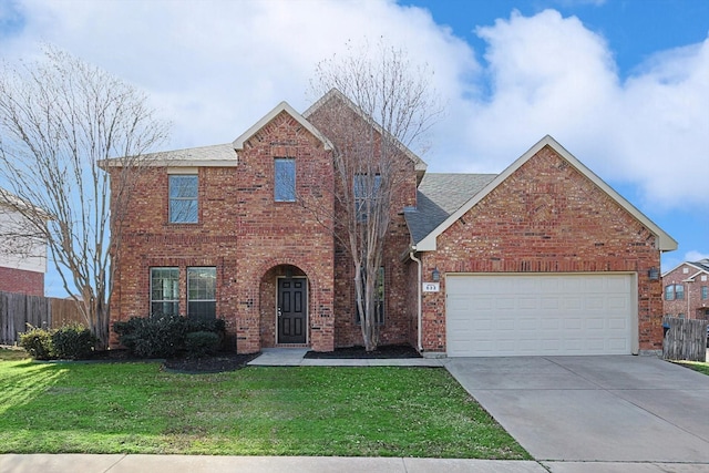 view of front property featuring a garage and a front yard