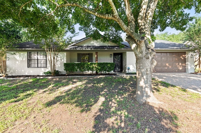 ranch-style home with a garage