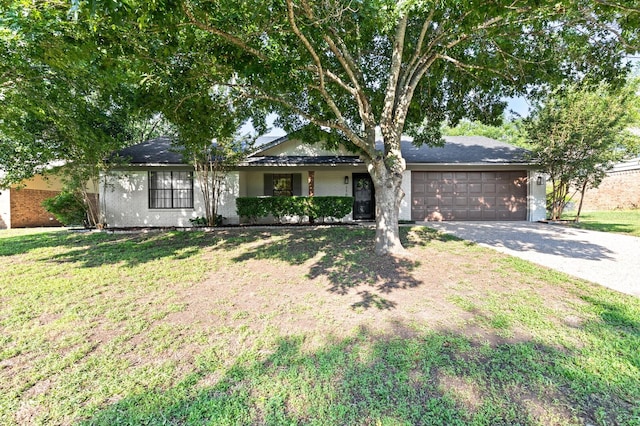 ranch-style home with a garage and a front lawn