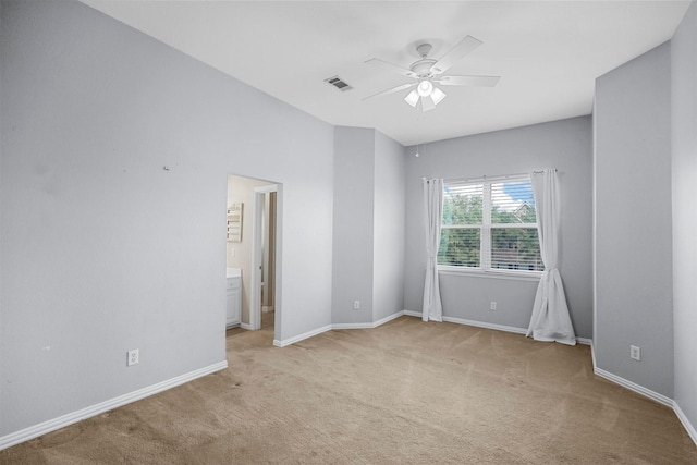 carpeted empty room featuring ceiling fan