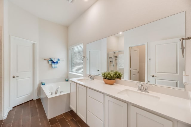 bathroom with plus walk in shower and vanity