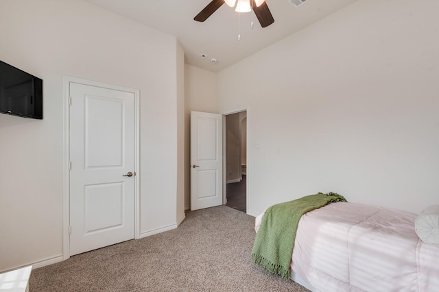 carpeted bedroom featuring ceiling fan