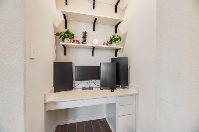 office area with built in desk and hardwood / wood-style floors