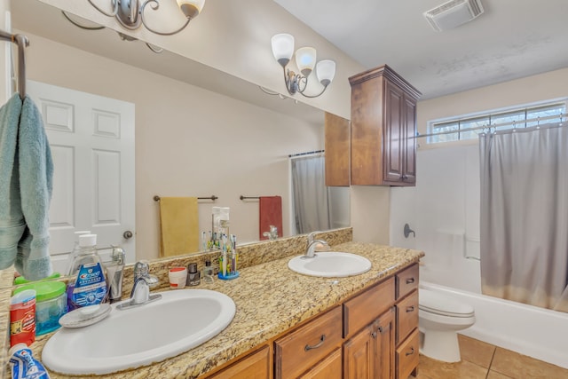 full bathroom featuring tile patterned flooring, vanity, toilet, and shower / bath combo with shower curtain