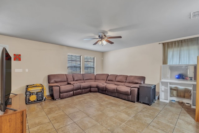 tiled living room with ceiling fan