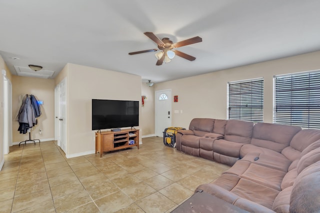 tiled living room featuring ceiling fan