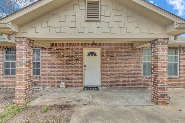 doorway to property featuring a patio