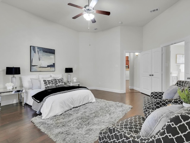 bedroom with dark wood-type flooring and ceiling fan