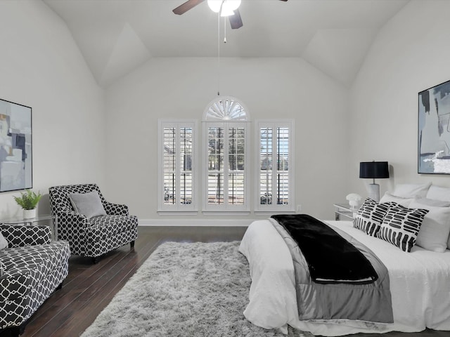 bedroom with lofted ceiling, dark wood-type flooring, and ceiling fan