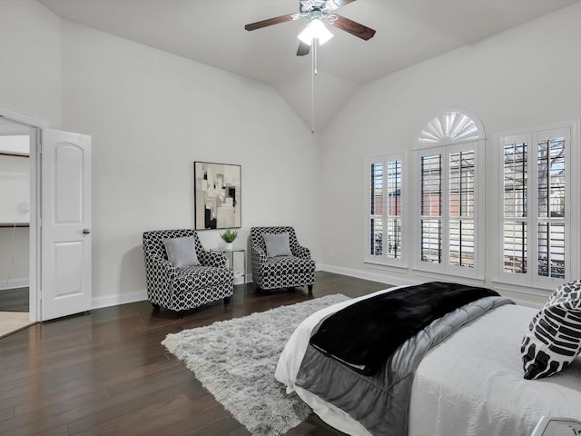 bedroom featuring ceiling fan, lofted ceiling, and dark hardwood / wood-style flooring