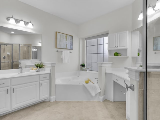 bathroom with tile patterned flooring, vanity, and shower with separate bathtub