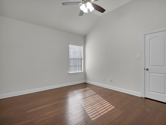 unfurnished room with dark hardwood / wood-style flooring, vaulted ceiling, and ceiling fan