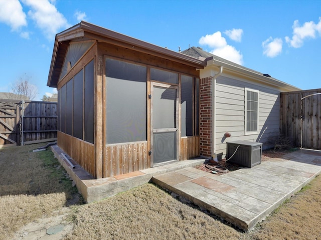 exterior space with a patio area and a lawn