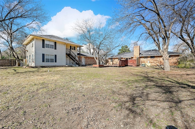 view of yard with a wooden deck