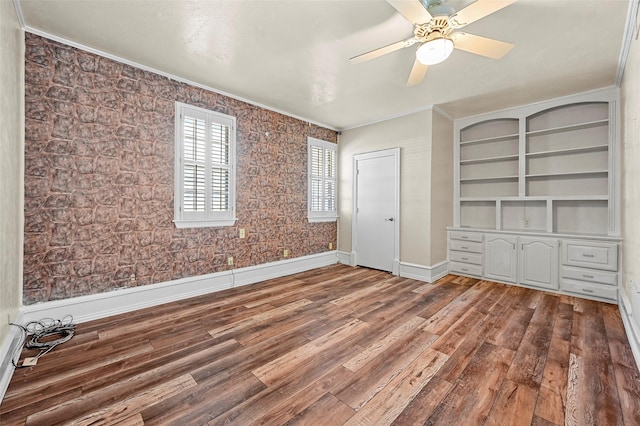 unfurnished bedroom featuring hardwood / wood-style flooring and ceiling fan