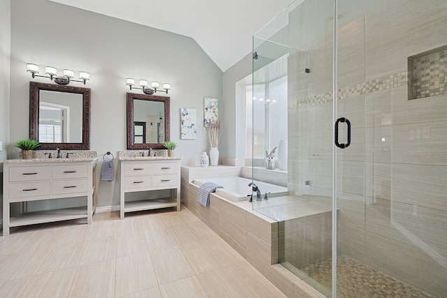 bathroom featuring tile patterned floors, vanity, plus walk in shower, and vaulted ceiling