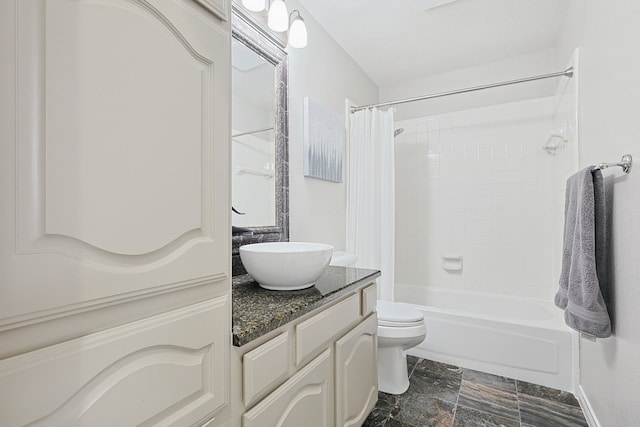 full bathroom featuring vanity, shower / tub combo, and toilet