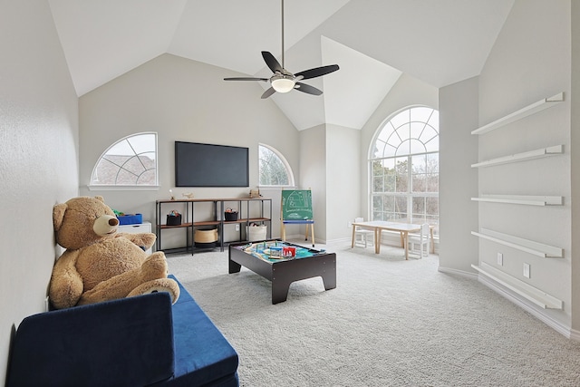 game room with high vaulted ceiling, carpet floors, and ceiling fan