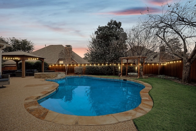 pool at dusk featuring a gazebo, a yard, and a patio area