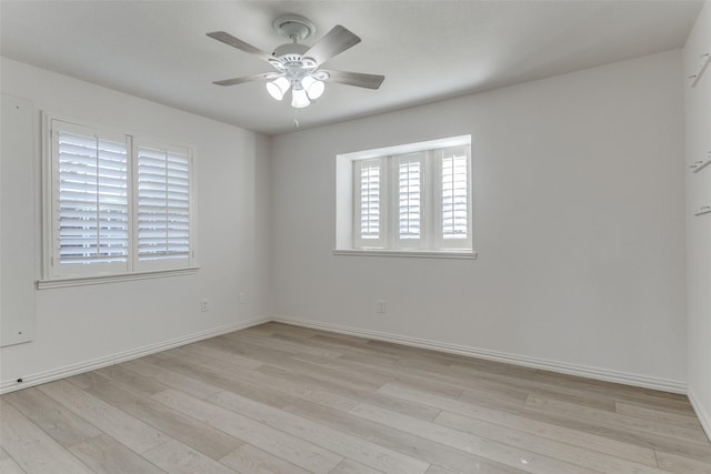 spare room featuring light hardwood / wood-style flooring and ceiling fan