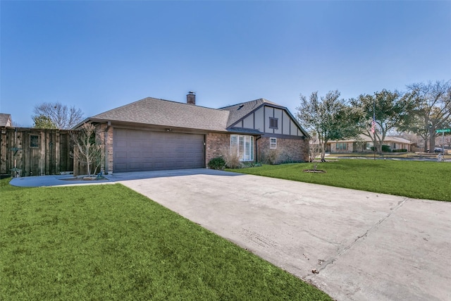 view of front of property with a garage and a front lawn