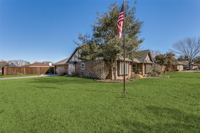 view of home's exterior with a lawn