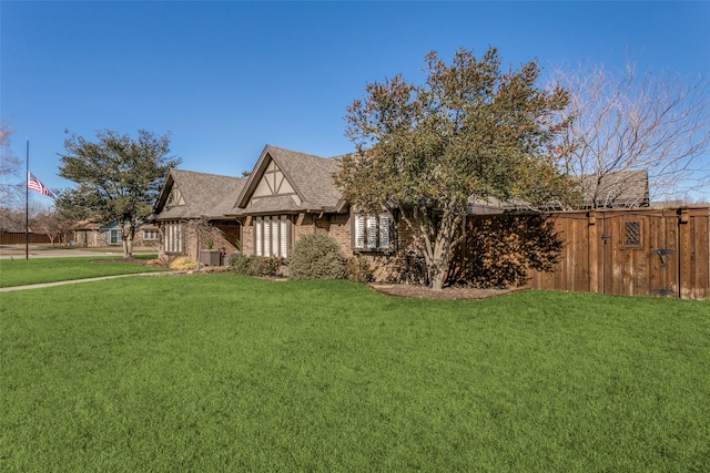 tudor house with a front yard