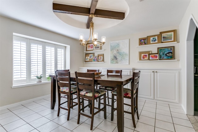 dining area with an inviting chandelier and light tile patterned floors