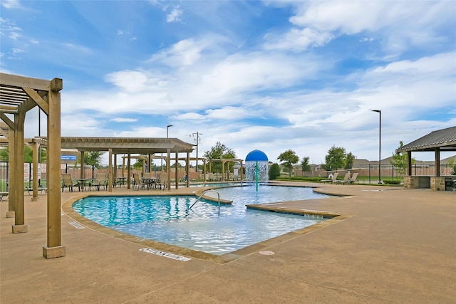 view of pool with a pergola, a patio area, and pool water feature