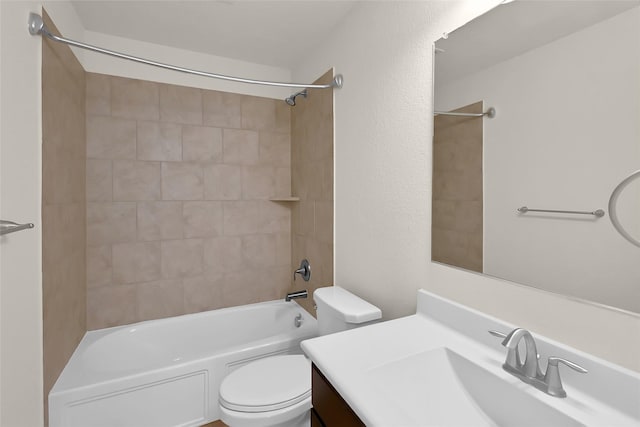 full bathroom with tiled shower / bath combo, vanity, and toilet